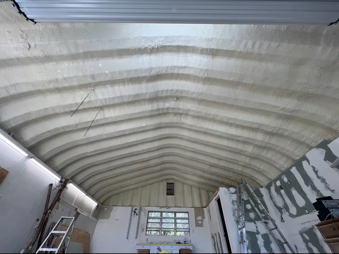 Spray polyurethane foam applied to the underside of a metal roof deck in Centerton